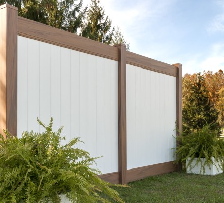 VEKA Privacy Fence with Signature Hazelnut post and rails, and white infill