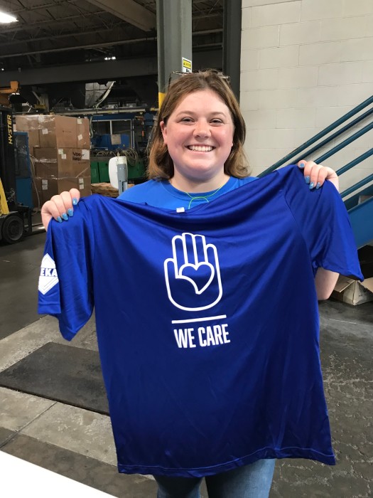 Happy VEKA Employee with We Care shirt