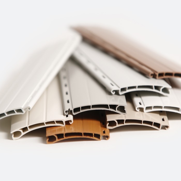 Roller shutter slats for plastic roller shutter panels