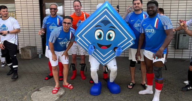 French players with the VEKA mascot