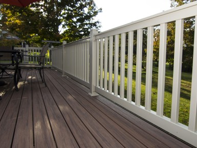 Floor board in Cayenne with a railing in white